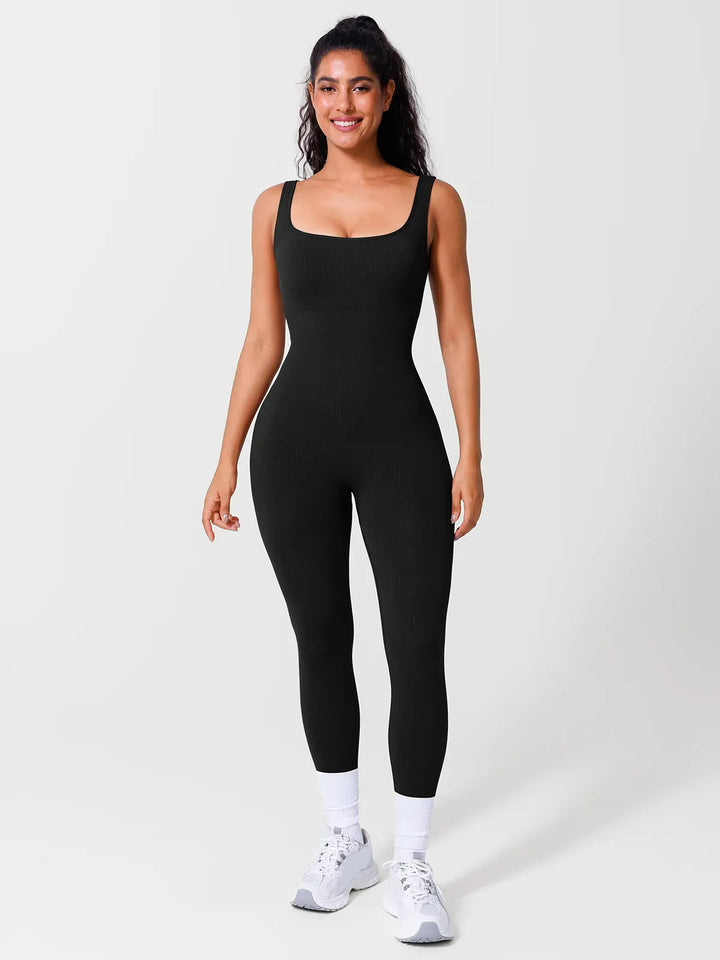A model wearing a BRXL® Yoga Activewear Jumpsuit Shapewear Seamless Square Neck Tank Workout Jumpsuit in Black / S