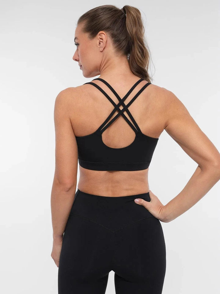 A model wearing a BRXL® Sports Bra Sculpted Shorts Sculpted Leggings Set in