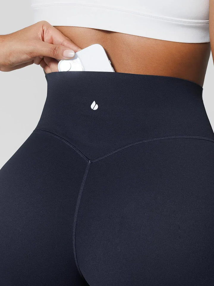 A model wearing a BRXL® Tummy Control Wide Leg Activewear Leggings in