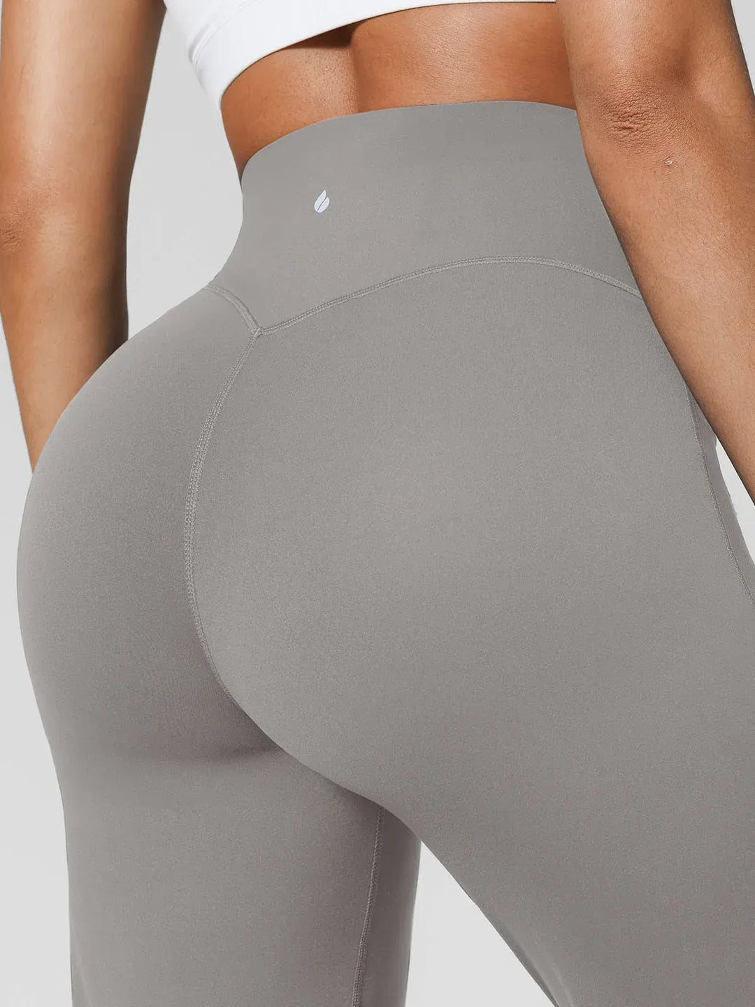 A model wearing a BRXL® Tummy Control Wide Leg Activewear Leggings in