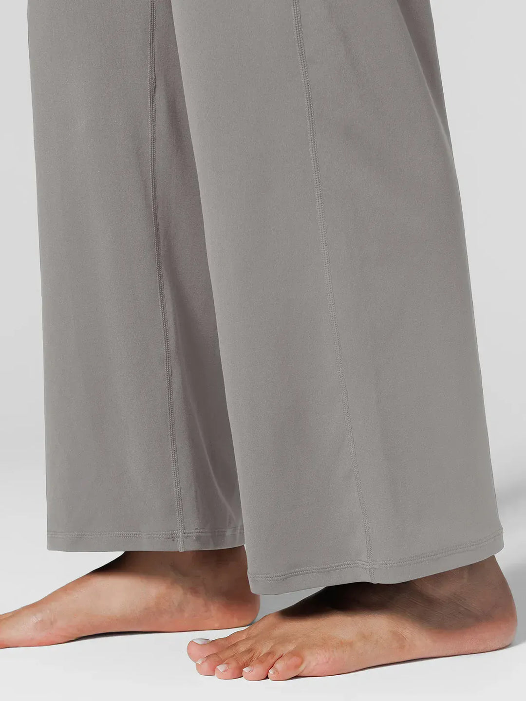 A model wearing a BRXL® Tummy Control Wide Leg Activewear Leggings in