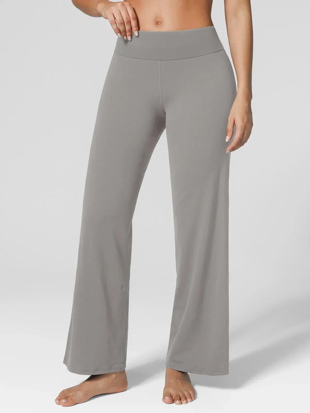 A model wearing a BRXL® Tummy Control Wide Leg Activewear Leggings in