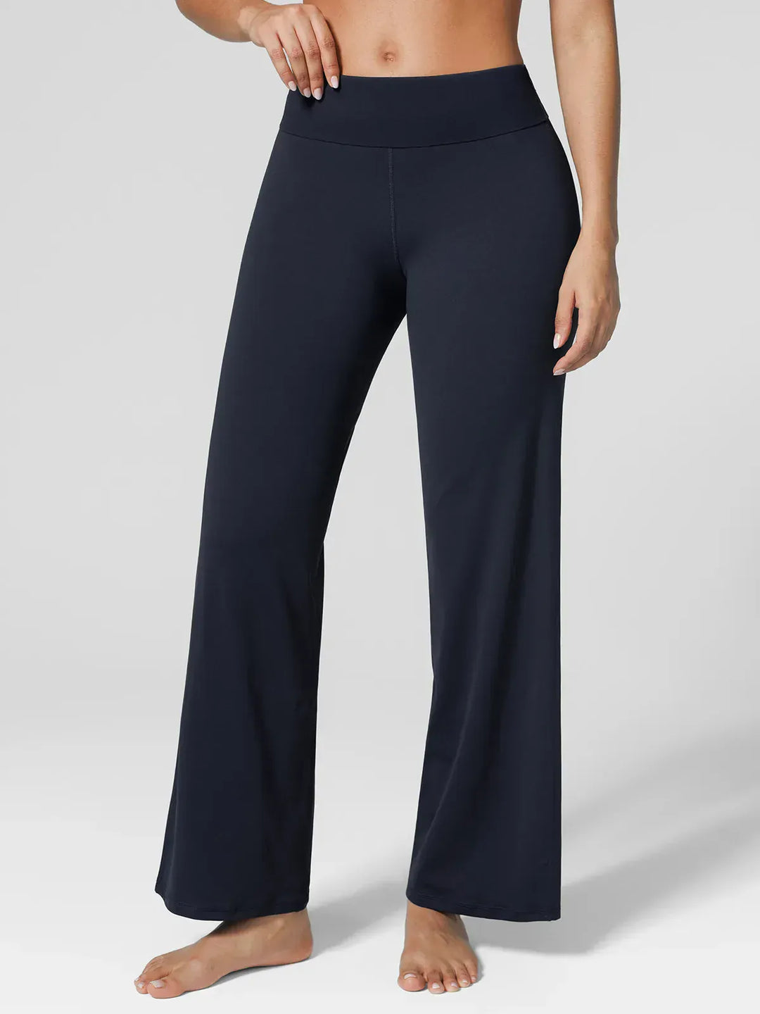 A model wearing a BRXL® Tummy Control Wide Leg Activewear Leggings in