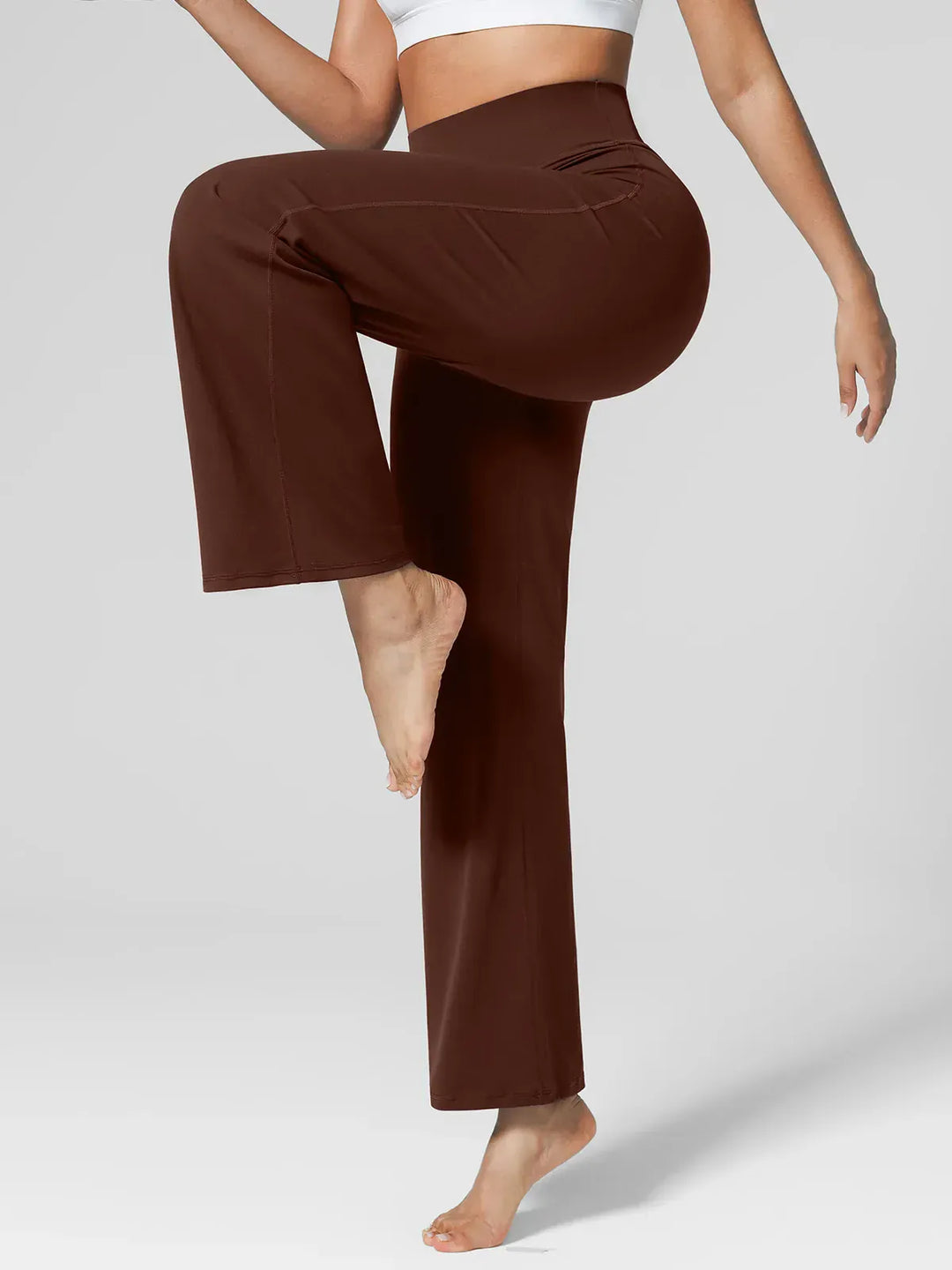 A model wearing a BRXL® Tummy Control Wide Leg Activewear Leggings in