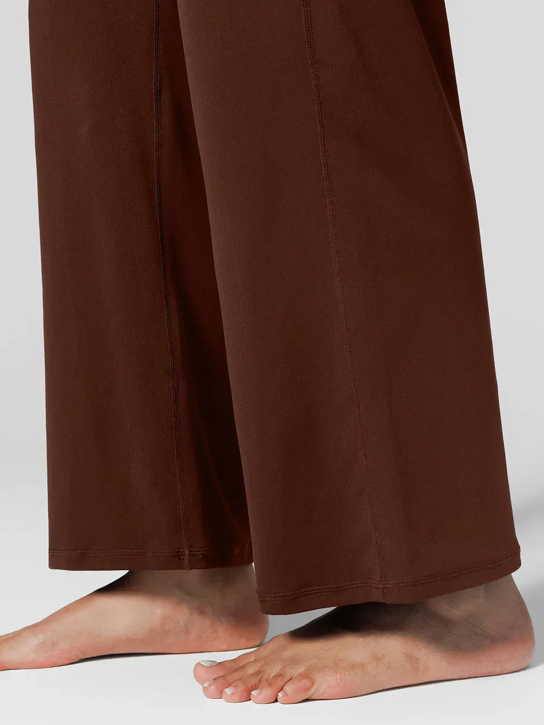 A model wearing a BRXL® Tummy Control Wide Leg Activewear Leggings in