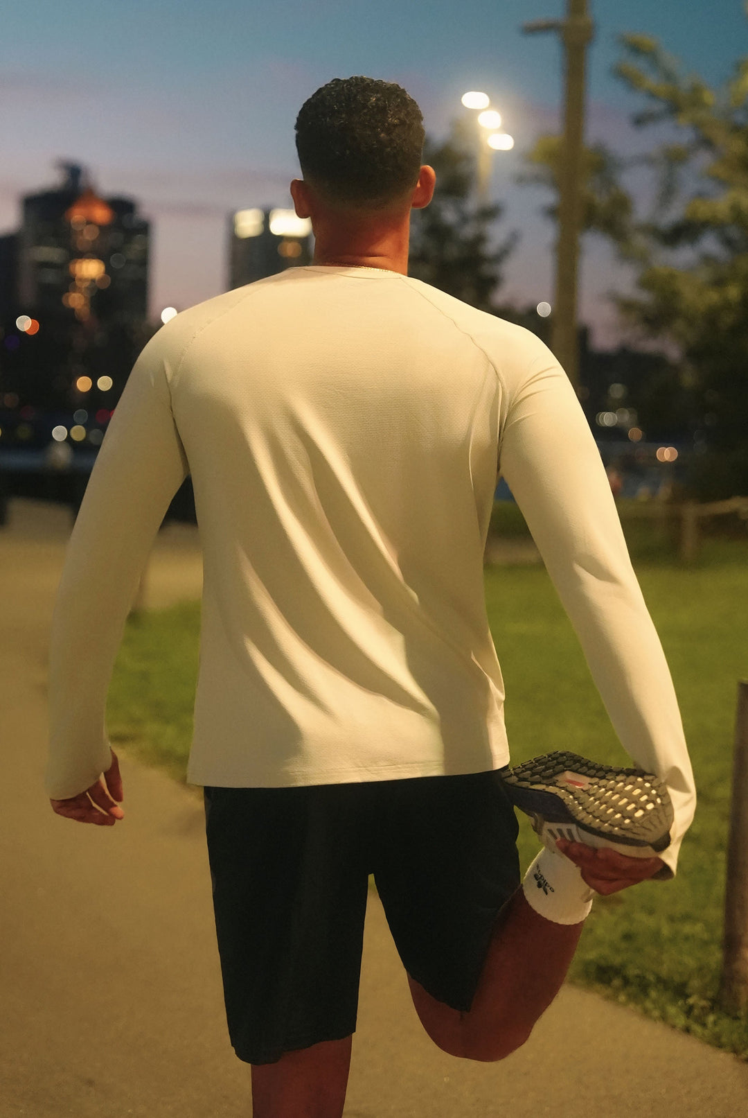 Woman wearing BRXL women's running vest outdoors during a run img