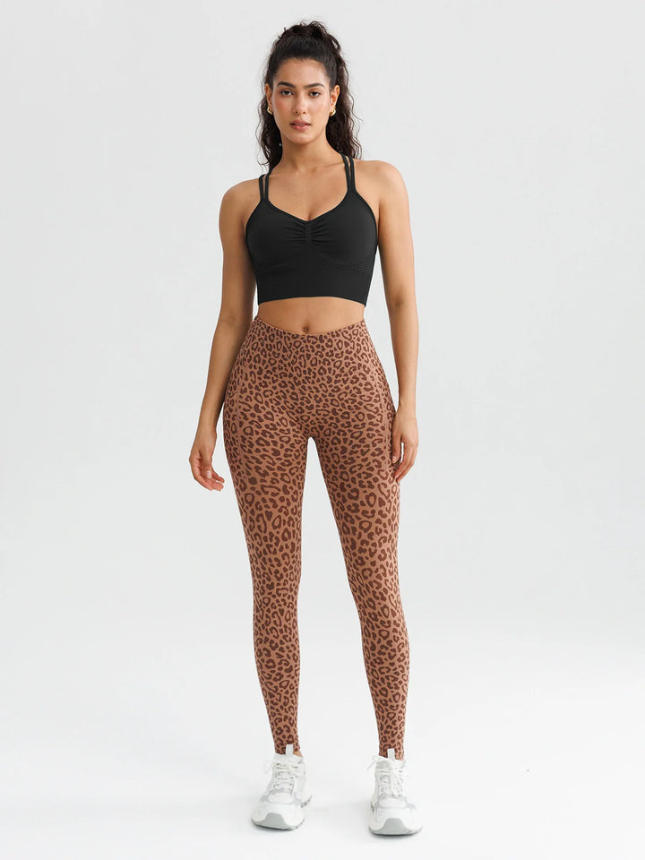 A model wearing a BRXL® B R X L™ Seamless High Waisted Butt-Lifting Leggings with Pockets