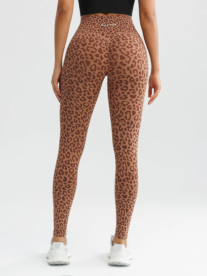 A model wearing a BRXL® B R X L™ Seamless High Waisted Butt-Lifting Leggings with Pockets