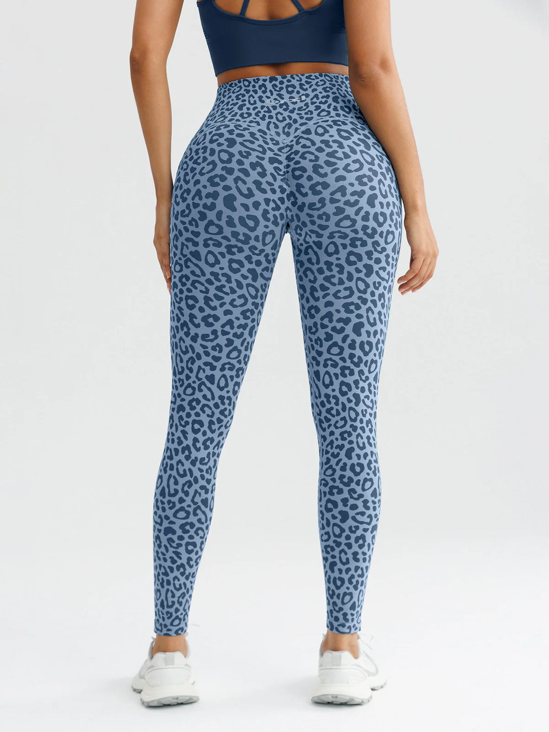 A model wearing a BRXL® B R X L™ Seamless High Waisted Butt-Lifting Leggings with Pockets