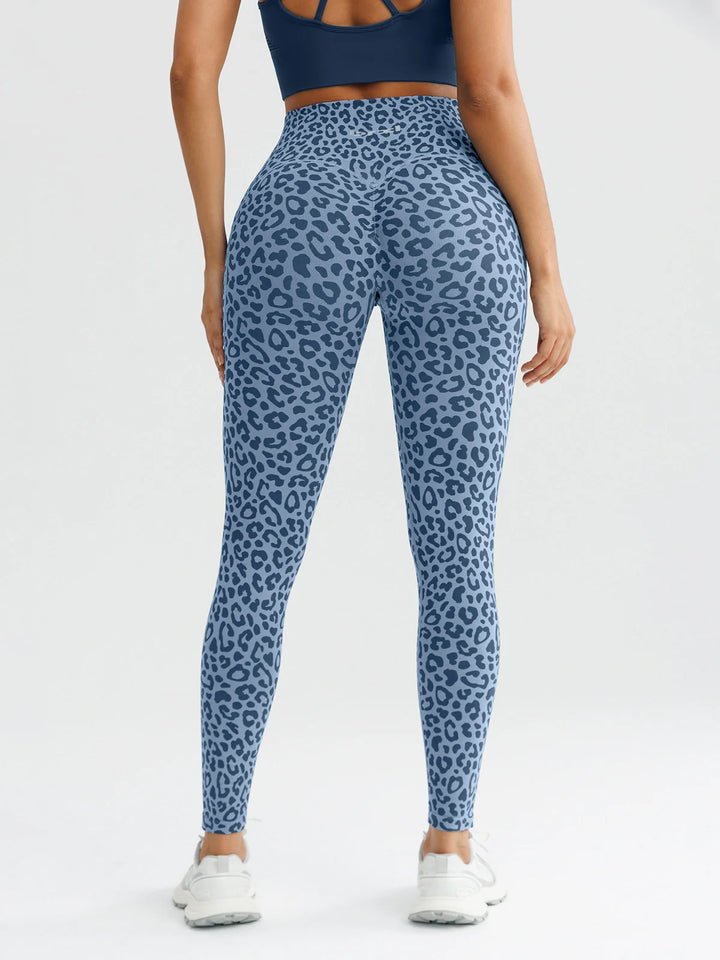 A model wearing a BRXL® B R X L™ Seamless High Waisted Butt-Lifting Leggings with Pockets