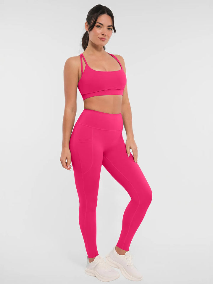 Woman wearing a BRXL pink leggings and sports bra.