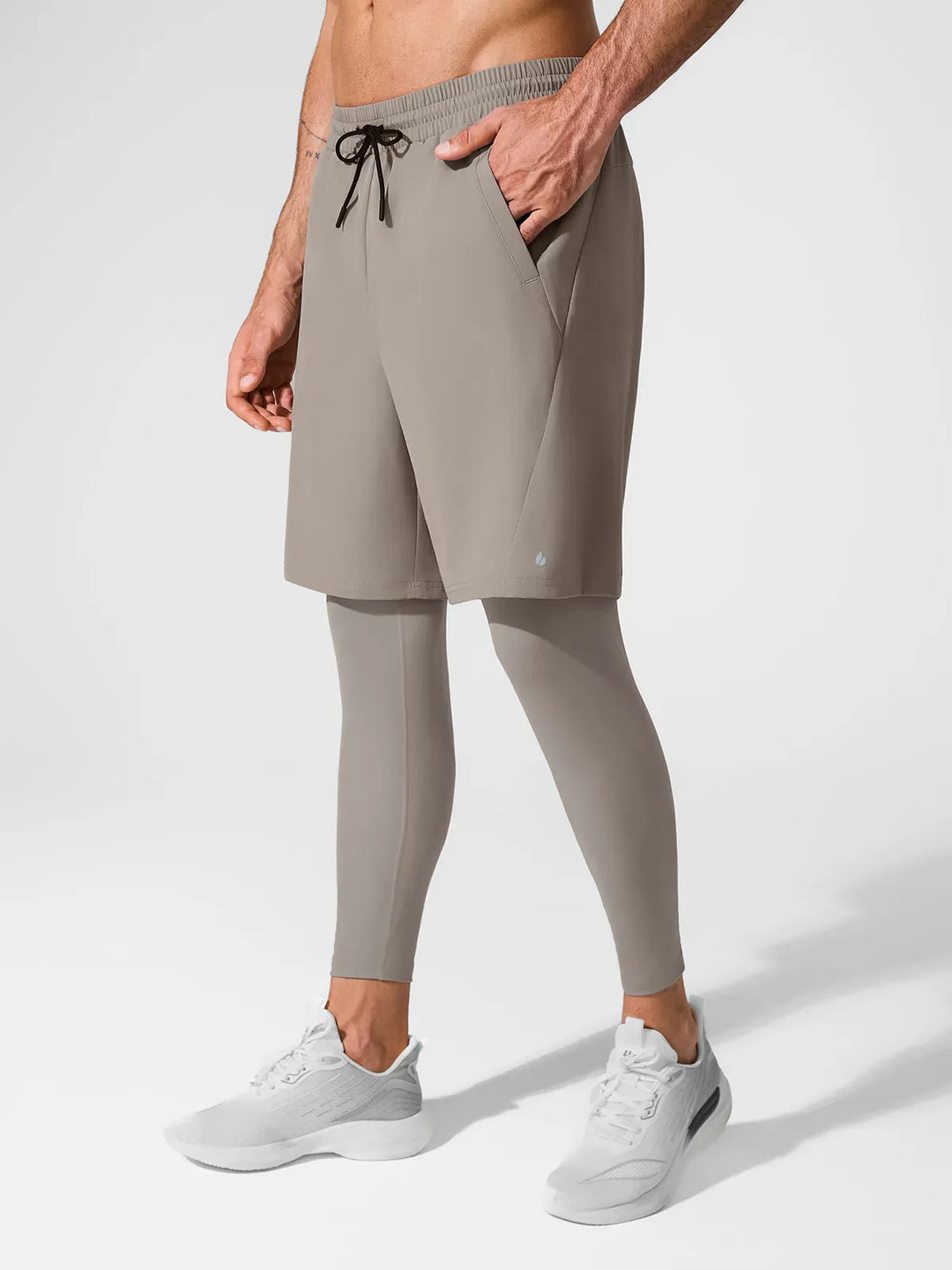 A model wearing a BRXL® 2-in-1 Training Pants for Men in