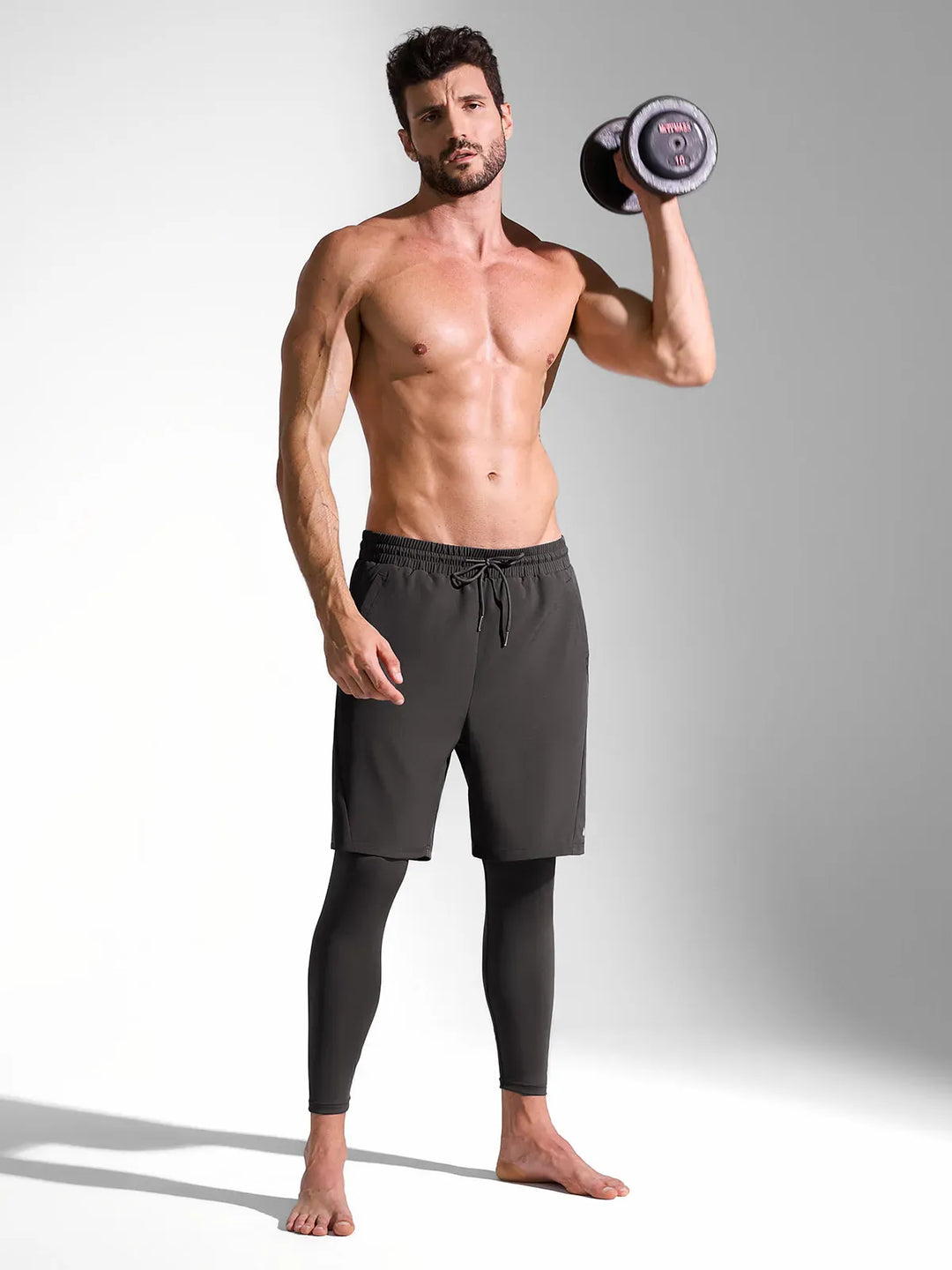 A model wearing a BRXL® 2-in-1 Training Pants for Men in