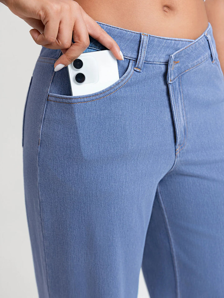A model wearing a BRXL® Asymmetrical Mid Rise Washed Casual Wide Leg Jeans with Pockets