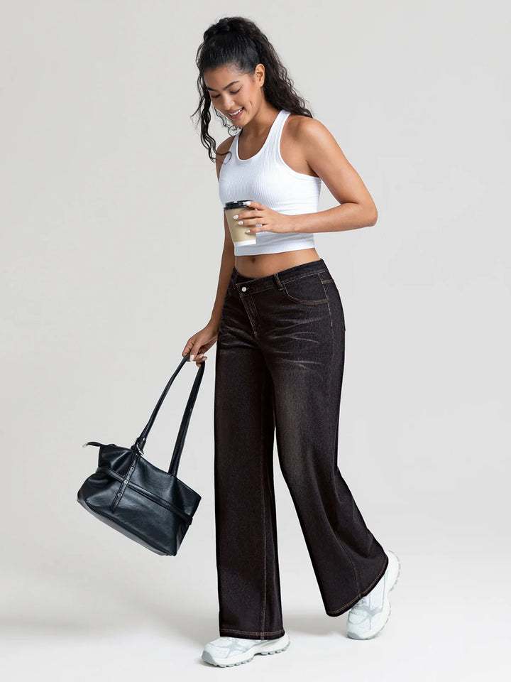 A model wearing a BRXL® Asymmetrical Mid Rise Washed Casual Wide Leg Jeans with Pockets