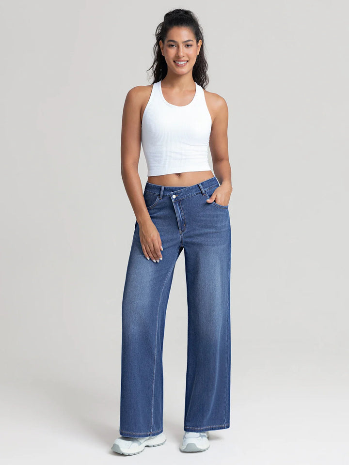 A model wearing a BRXL® Asymmetrical Mid Rise Washed Casual Wide Leg Jeans with Pockets
