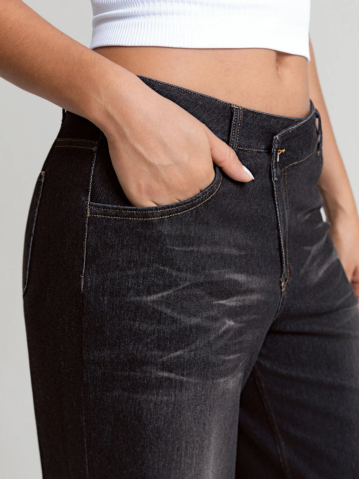 A model wearing a BRXL® Asymmetrical Mid Rise Washed Casual Wide Leg Jeans with Pockets