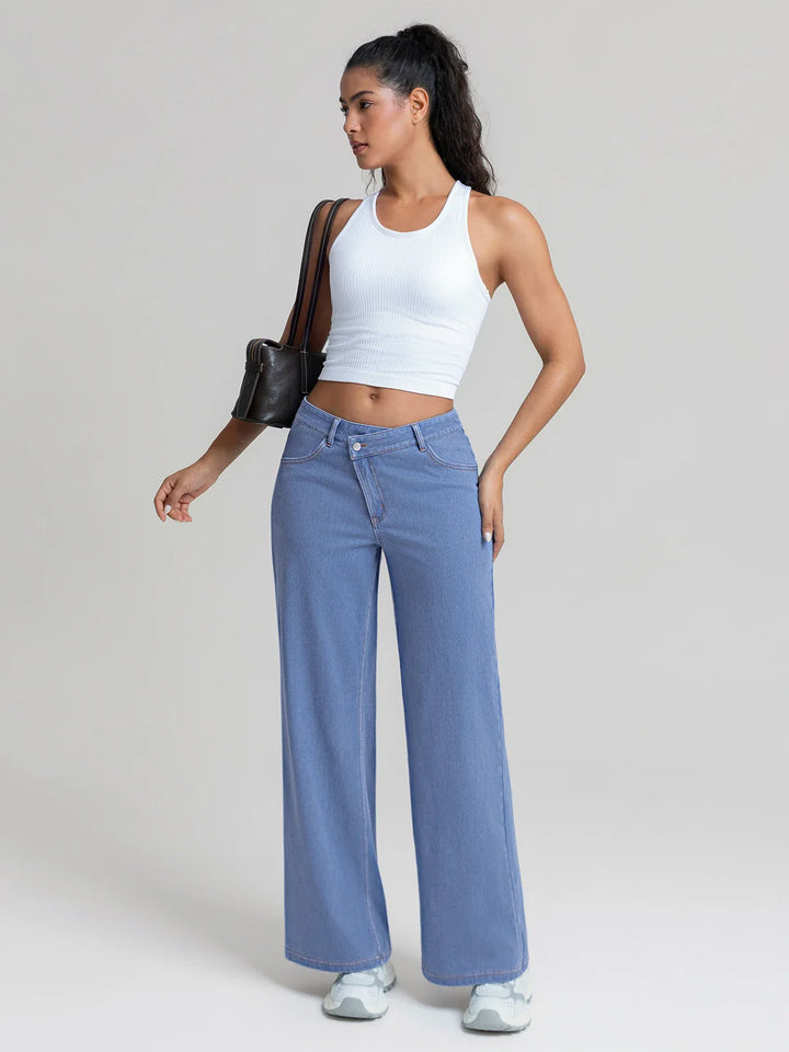 A model wearing a BRXL® Asymmetrical Mid Rise Washed Casual Wide Leg Jeans with Pockets