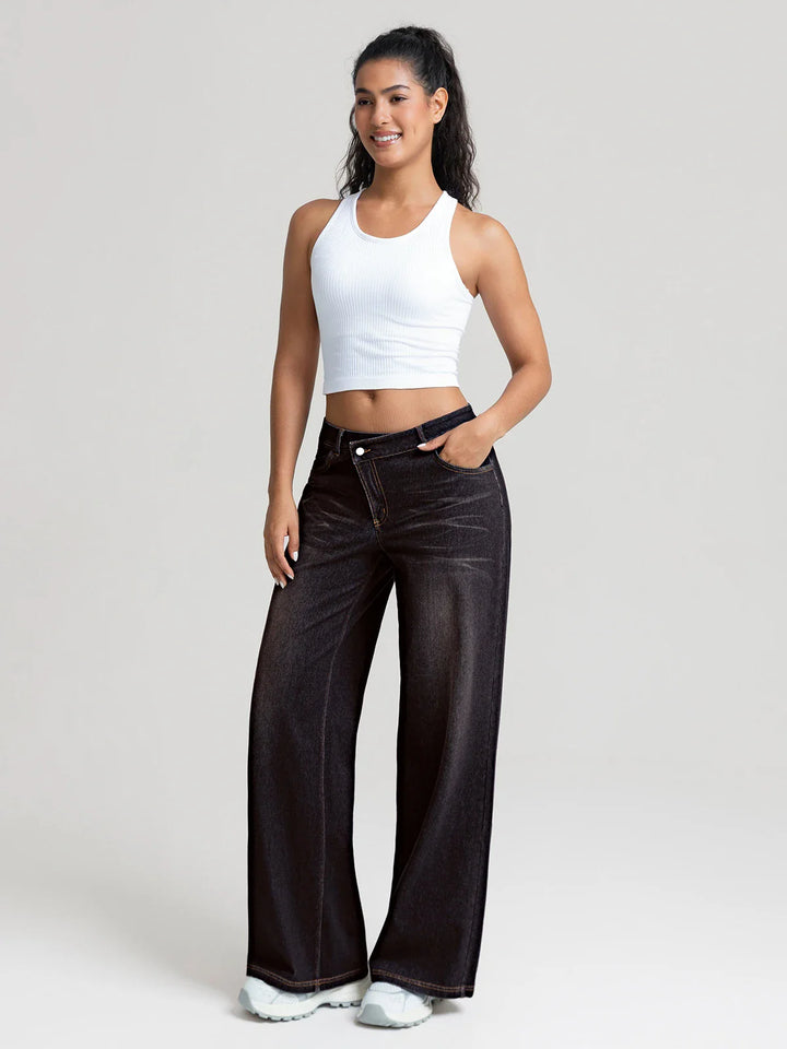 A model wearing a BRXL® Asymmetrical Mid Rise Washed Casual Wide Leg Jeans with Pockets