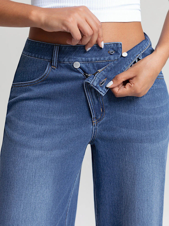 A model wearing a BRXL® Asymmetrical Mid Rise Washed Casual Wide Leg Jeans with Pockets