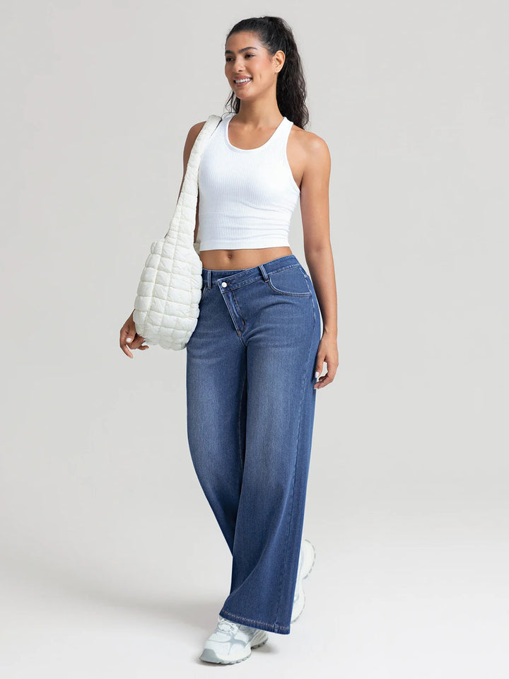 A model wearing a BRXL® Asymmetrical Mid Rise Washed Casual Wide Leg Jeans with Pockets