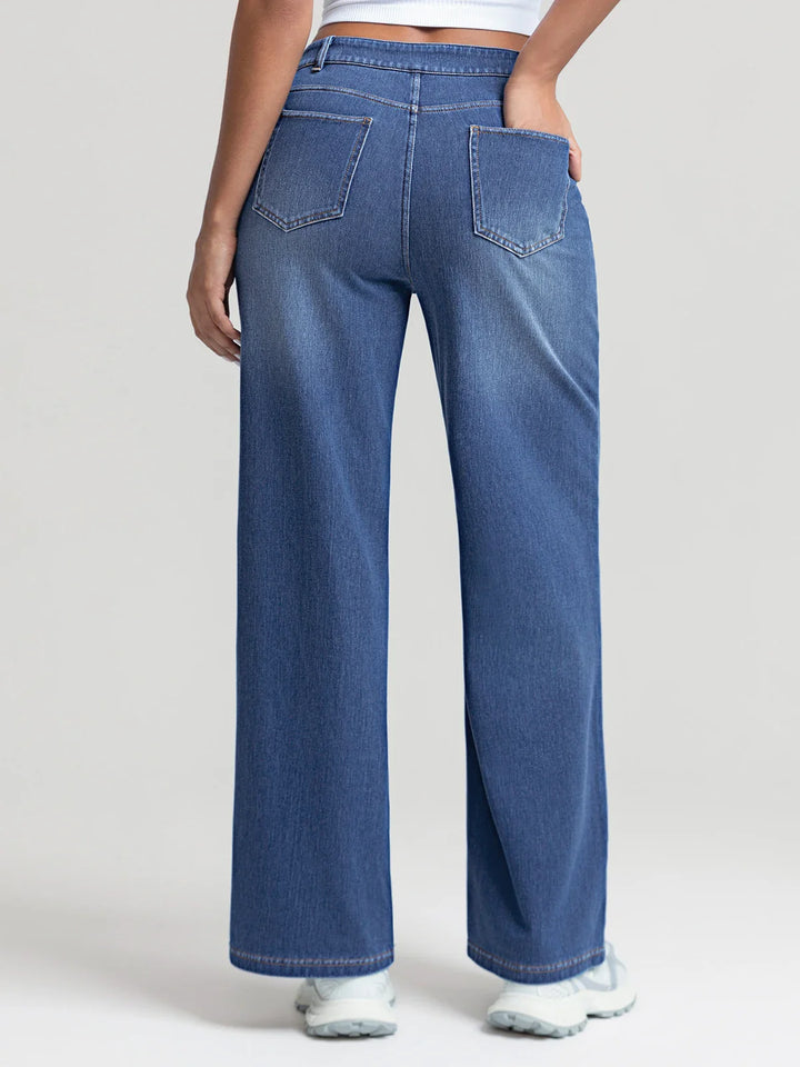 A model wearing a BRXL® Asymmetrical Mid Rise Washed Casual Wide Leg Jeans with Pockets
