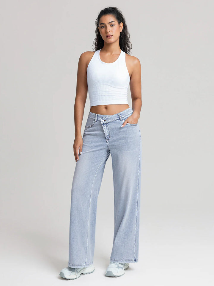 A model wearing a BRXL® Asymmetrical Mid Rise Washed Casual Wide Leg Jeans with Pockets