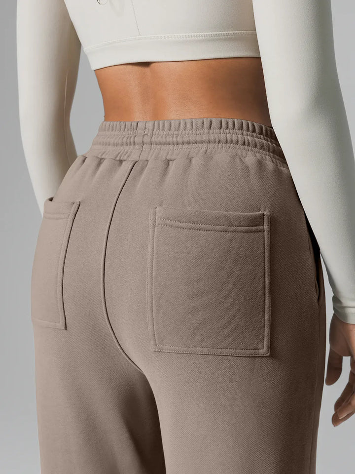 A model wearing a BRXL® Athleisure Drawstring Waist  Wide Leg Sweatpants in