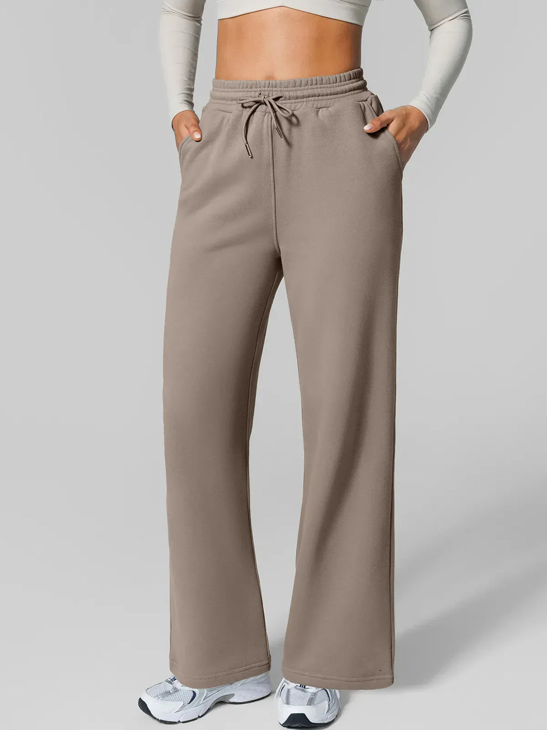 A model wearing a BRXL® Athleisure Drawstring Waist  Wide Leg Sweatpants in Charcoal / XS