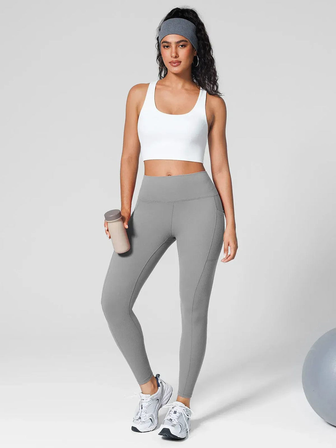 A model wearing a BRXL® Athleisure Four Pockets Cropped Jacket,One Size Fits Most Sporty High-Waisted Leggings in