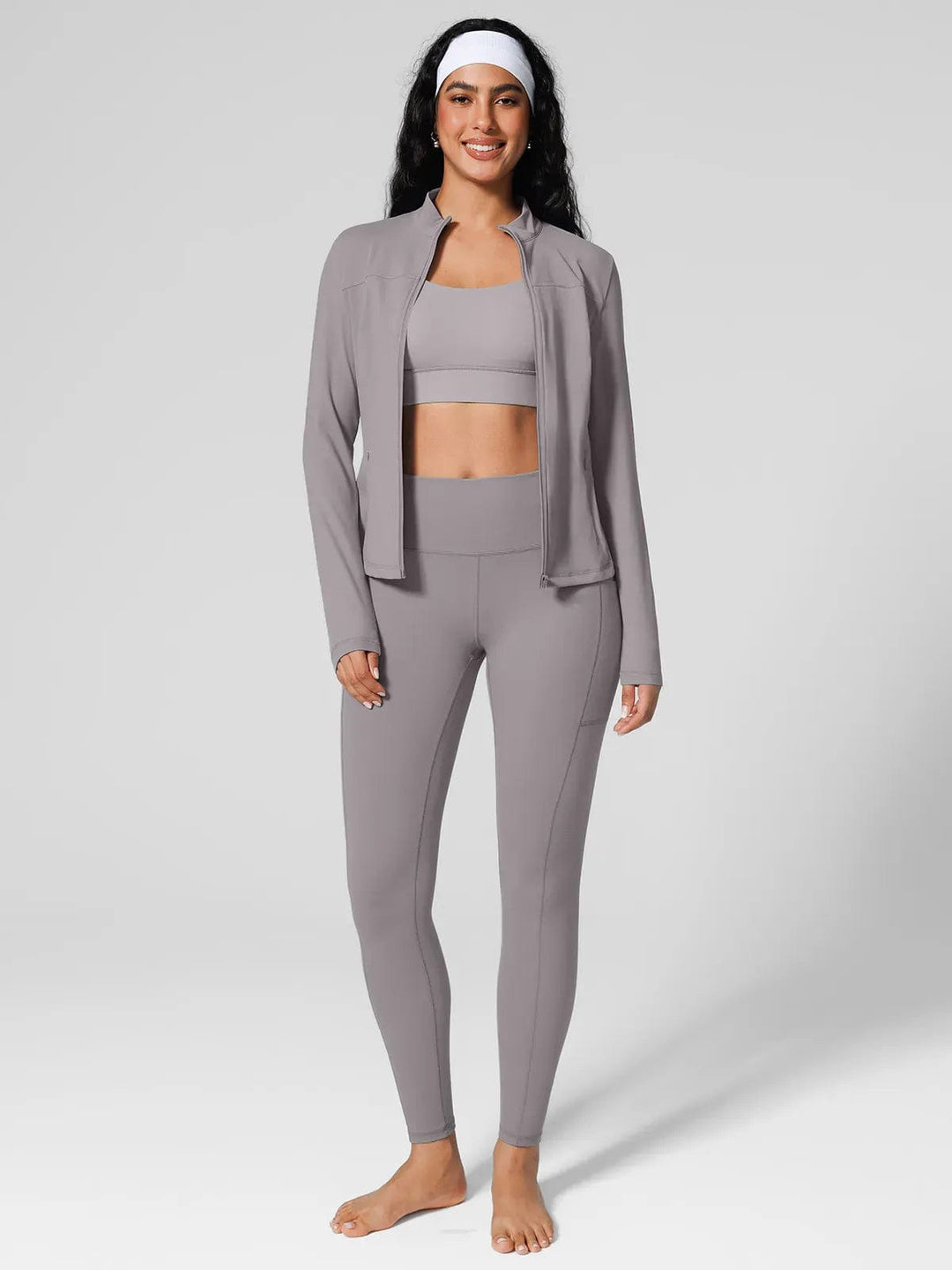 A model wearing a BRXL® Athleisure Four Pockets Cropped Jacket,One Size Fits Most Sporty High-Waisted Leggings in