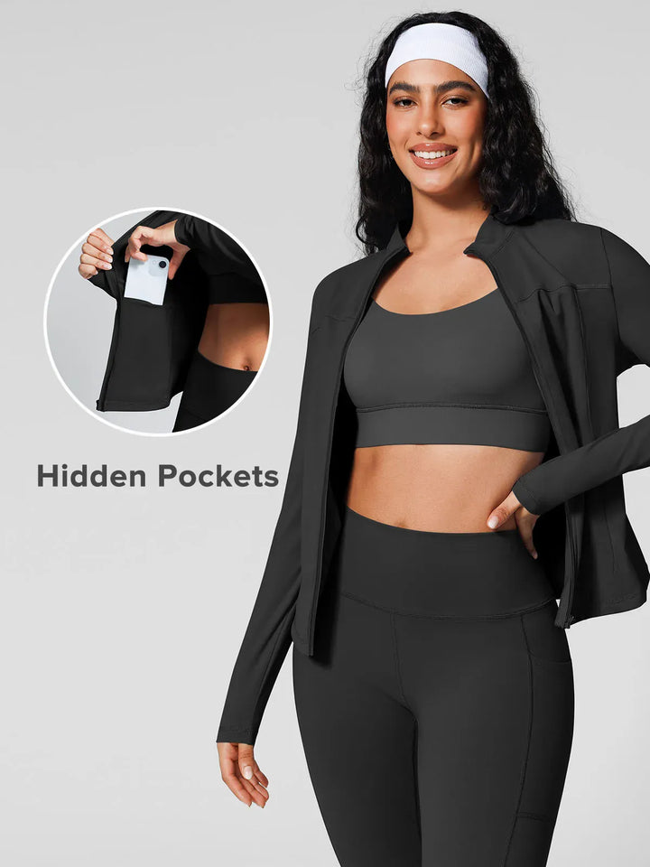 A model wearing a BRXL® Athleisure Hidden Pockets Cropped Jacket in