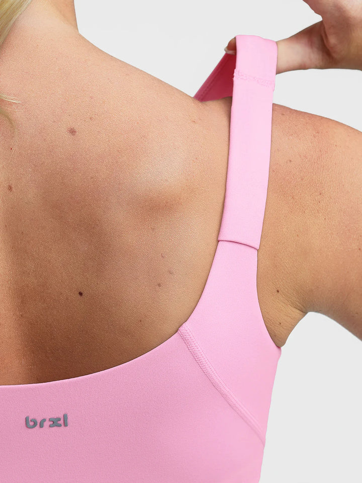 A model wearing a BRXL® B R X L™ Adjustable Strap U-Neck Cropped Tank Top