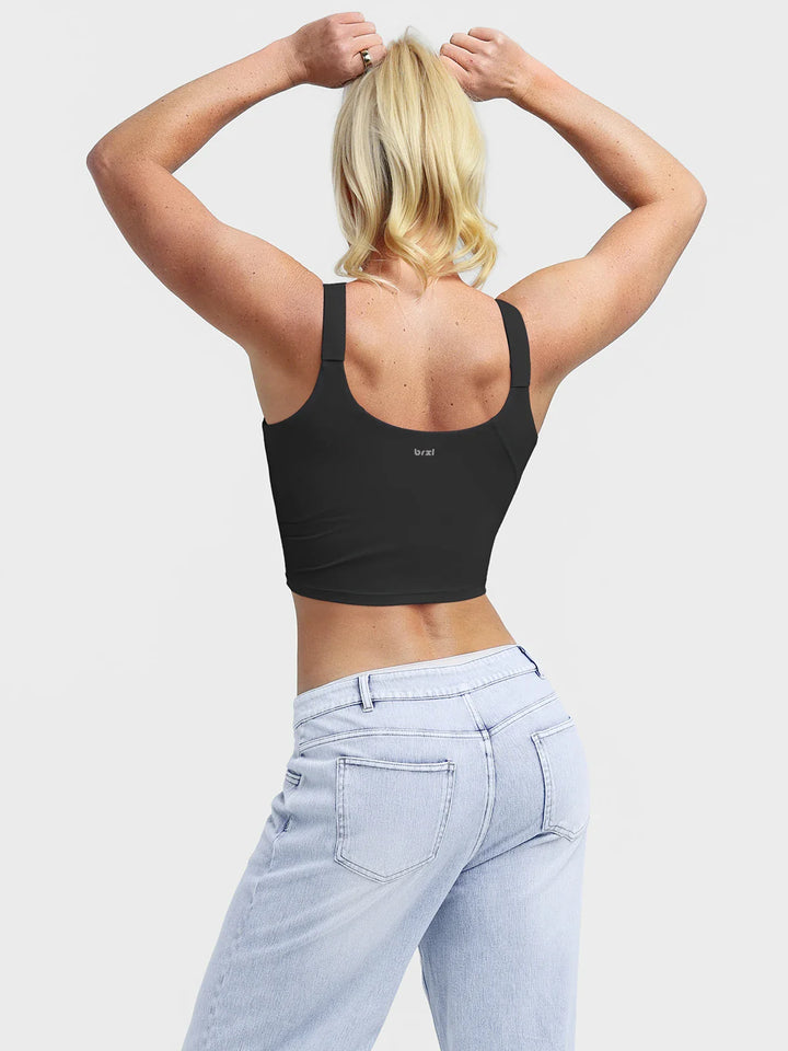 A model wearing a BRXL® B R X L™ Adjustable Strap U-Neck Cropped Tank Top