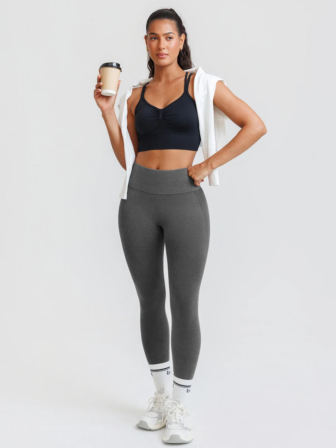 A model wearing a BRXL® B R X L™ Scrunch Butt Lifting Tummy Control High Waist Workout Leggings
