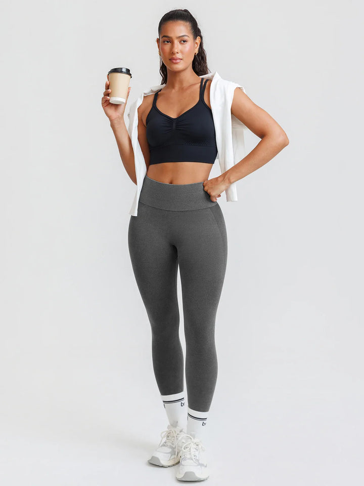 A model wearing a BRXL® B R X L™ Scrunch Butt Lifting Tummy Control High Waist Workout Leggings