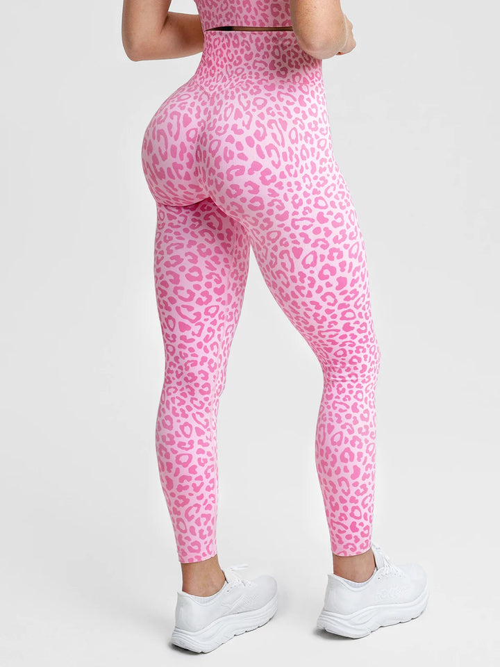 A model wearing a BRXL® B R X L® Scrunch Butt Lifting Tummy Control High Waist Workout Leggings Pink Leopard / XS