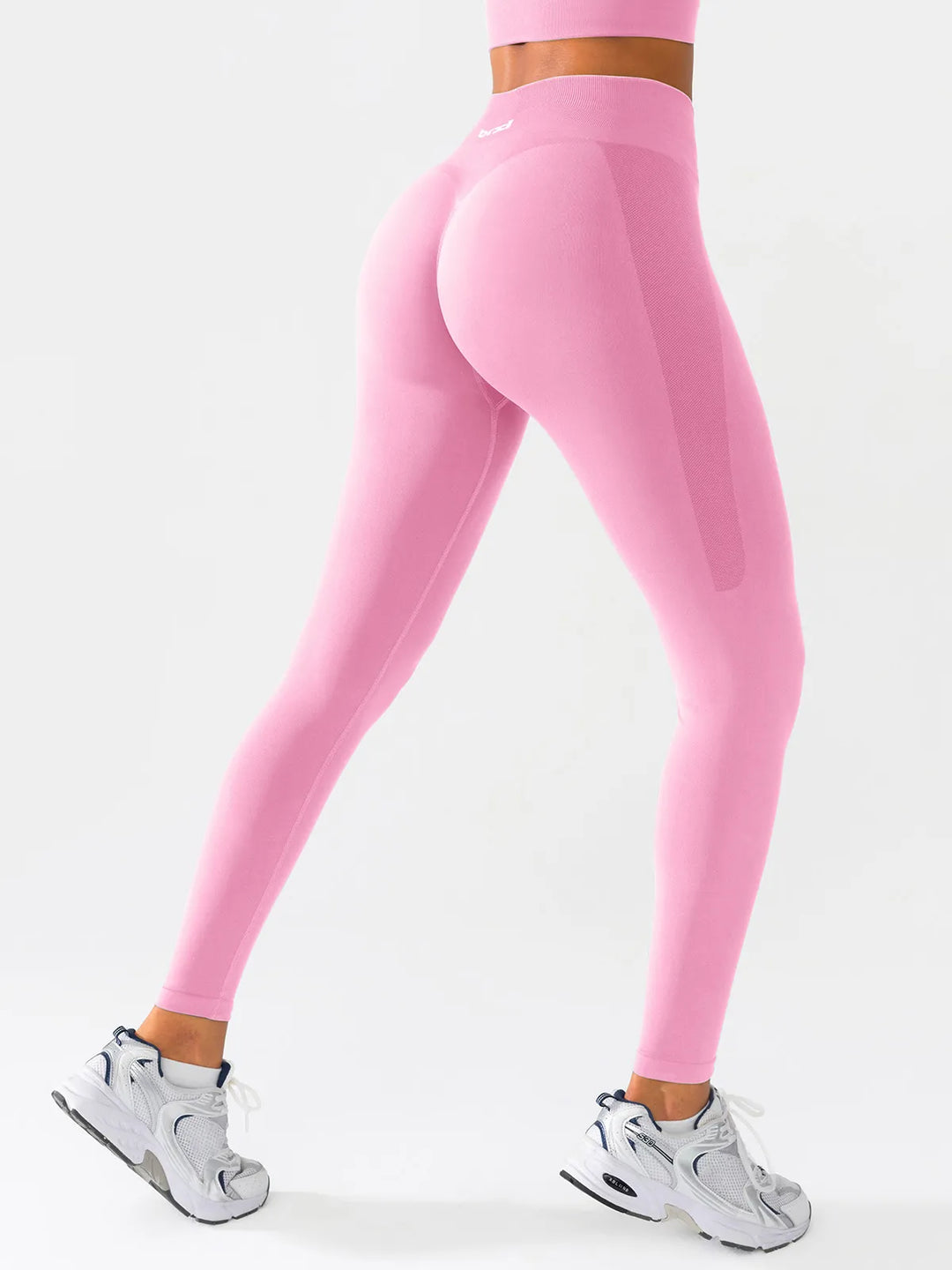 A model wearing a BRXL® B R X L™ Scrunch Butt Lifting Tummy Control High Waist Workout Leggings Rosy Pink (Core Sculpt) / XS