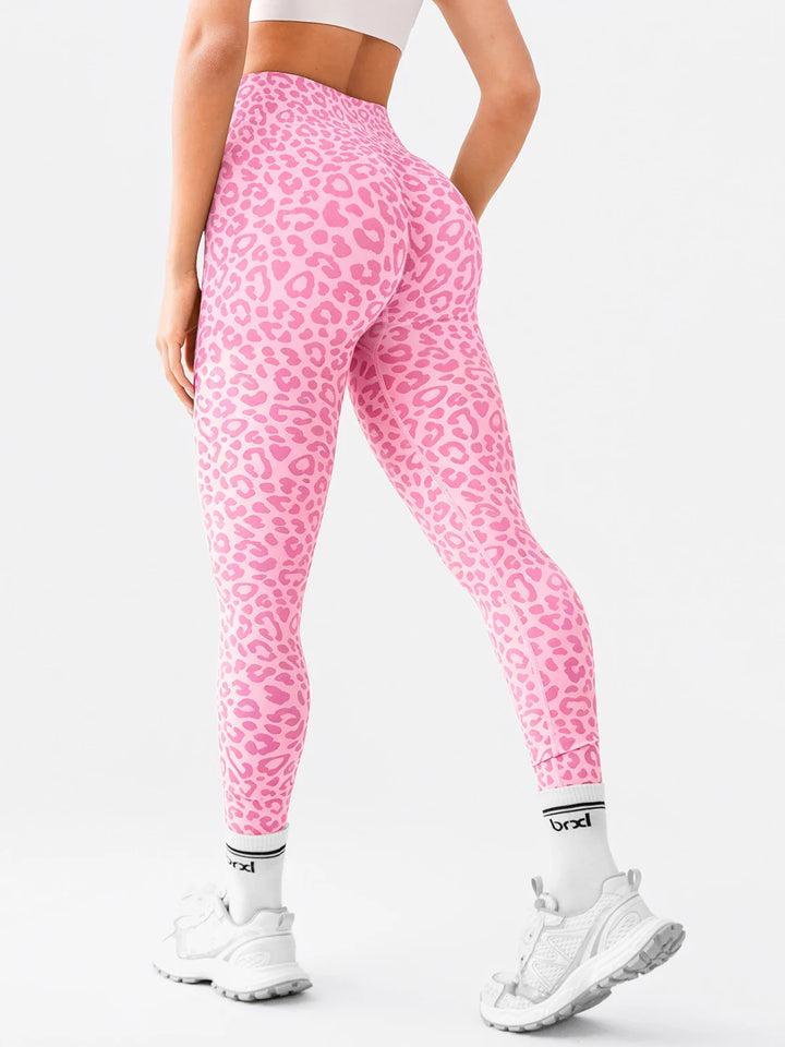 A model wearing a BRXL® B R X L™ Seamless High-Stretch High-Rise Sculpt Leggings 2.0 Pink Leopard / XS