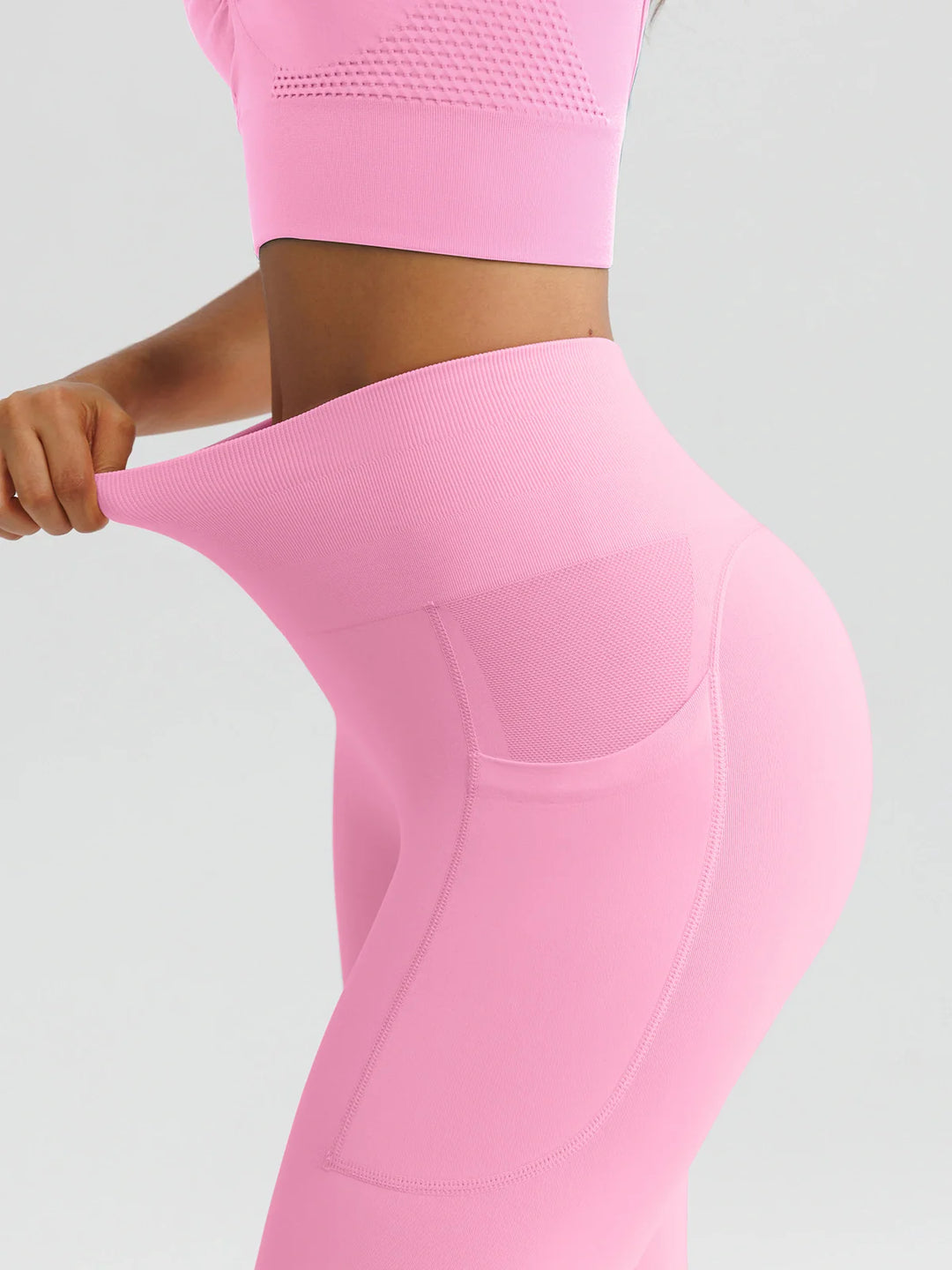 A model wearing a BRXL® B R X L™ Seamless High Waisted Butt-Lifting Leggings with Pockets