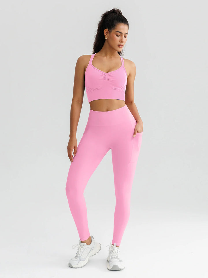 A model wearing a BRXL® B R X L™ Seamless High Waisted Butt-Lifting Leggings with Pockets