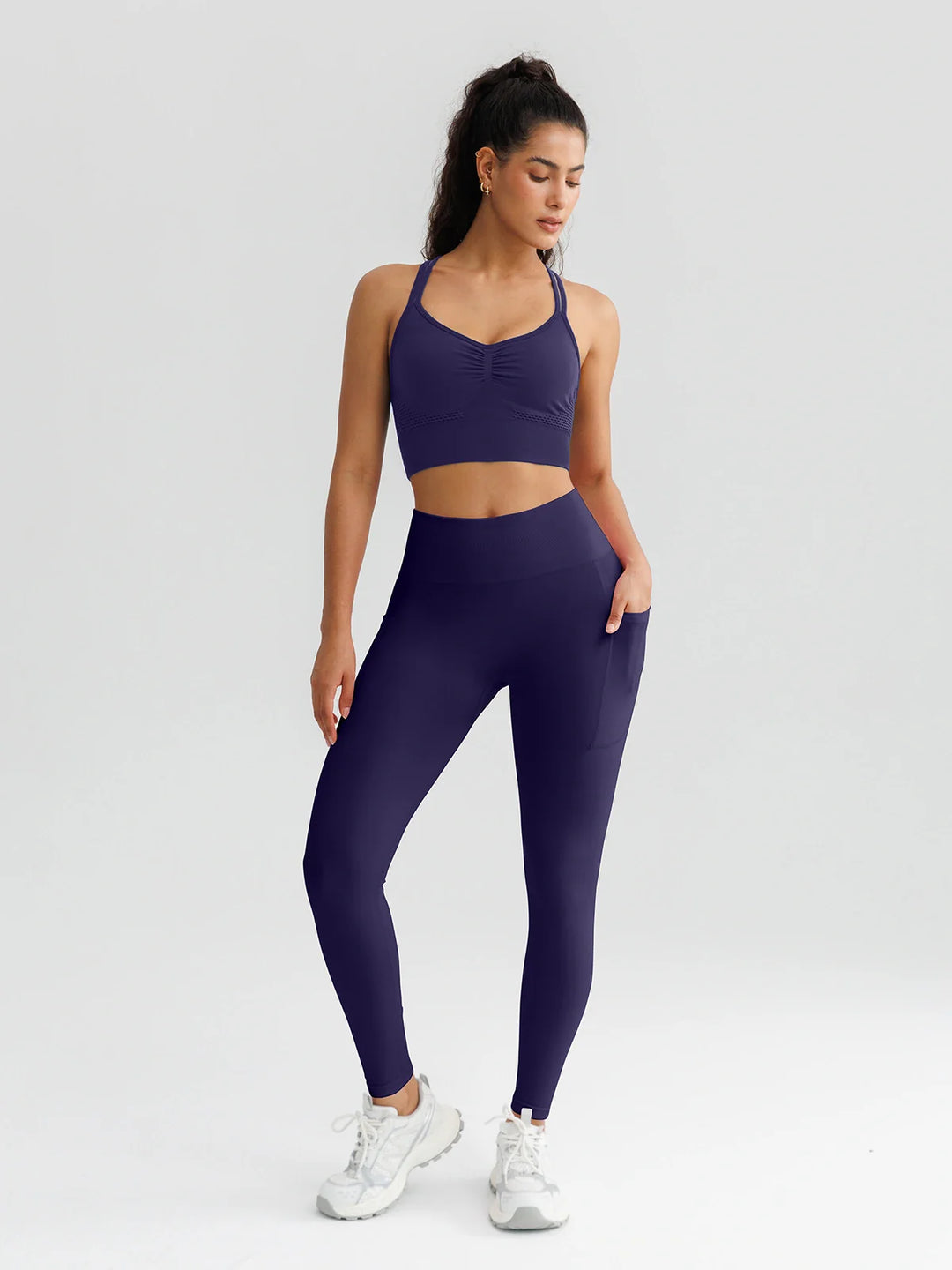 A model wearing a BRXL® B R X L™ Seamless High Waisted Butt-Lifting Leggings with Pockets