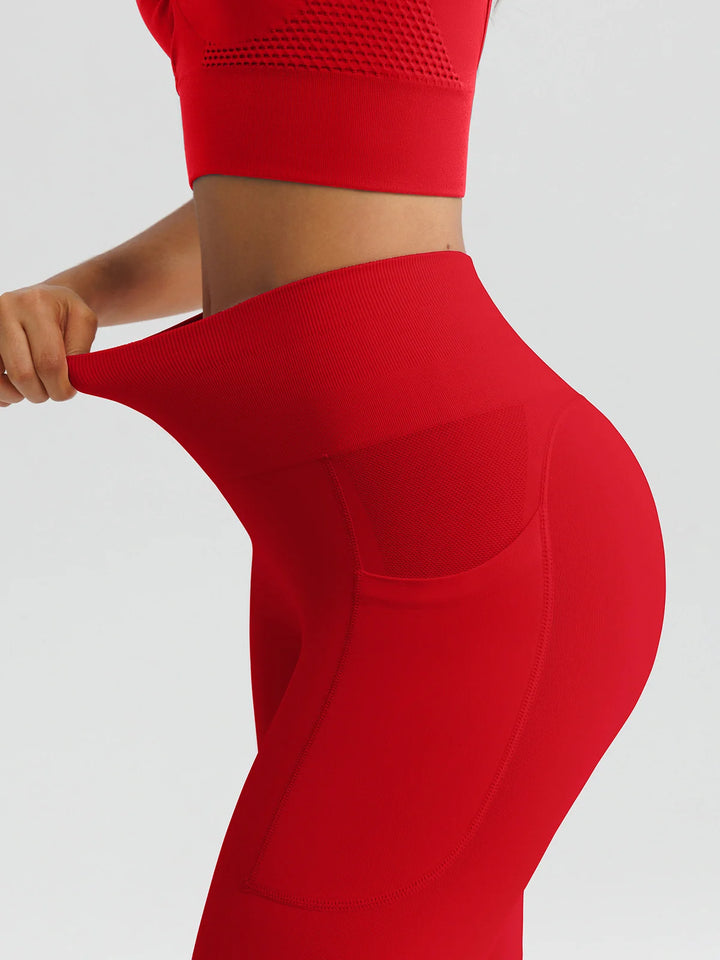 A model wearing a BRXL® B R X L™ Seamless High Waisted Butt-Lifting Leggings with Pockets