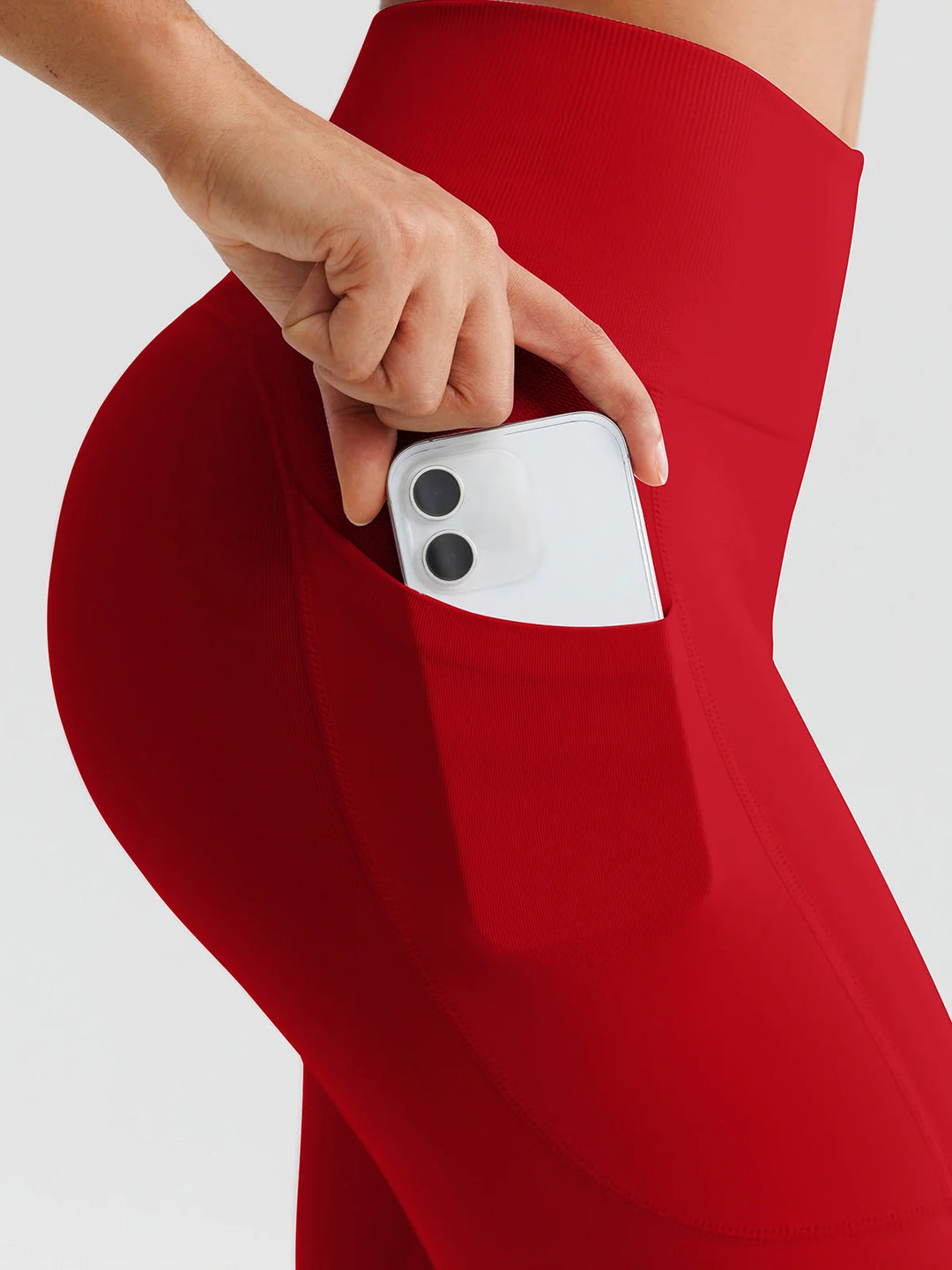 A model wearing a BRXL® B R X L™ Seamless High Waisted Butt-Lifting Leggings with Pockets