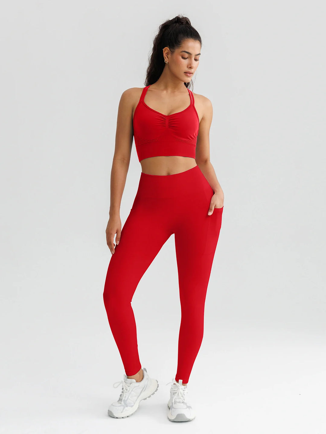 A model wearing a BRXL® B R X L™ Seamless High Waisted Butt-Lifting Leggings with Pockets