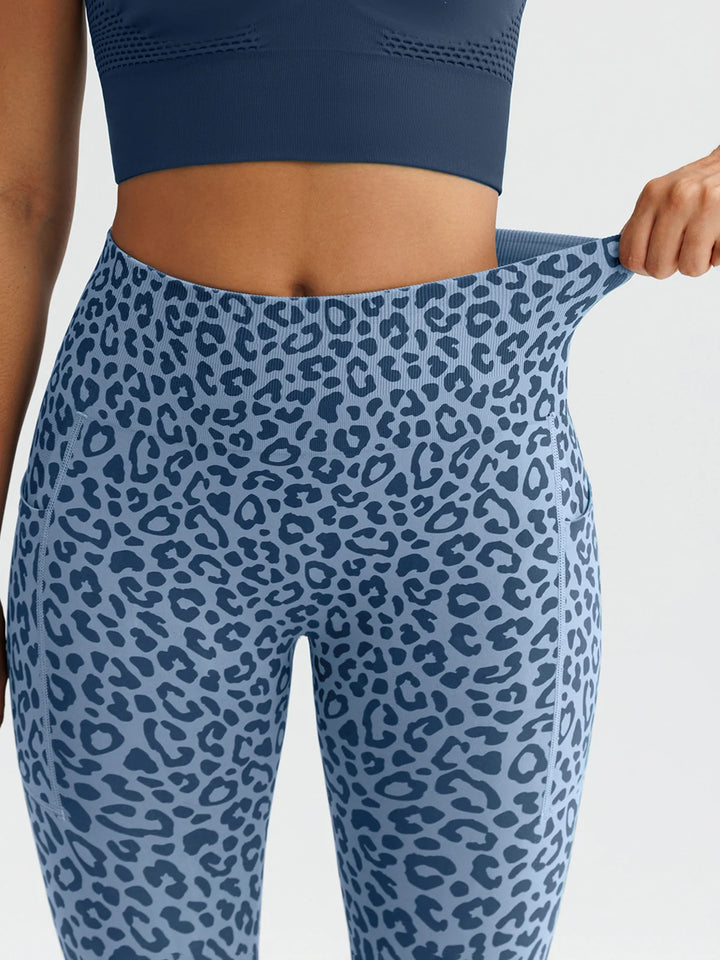 A model wearing a BRXL® B R X L™ Seamless High Waisted Butt-Lifting Leggings with Pockets