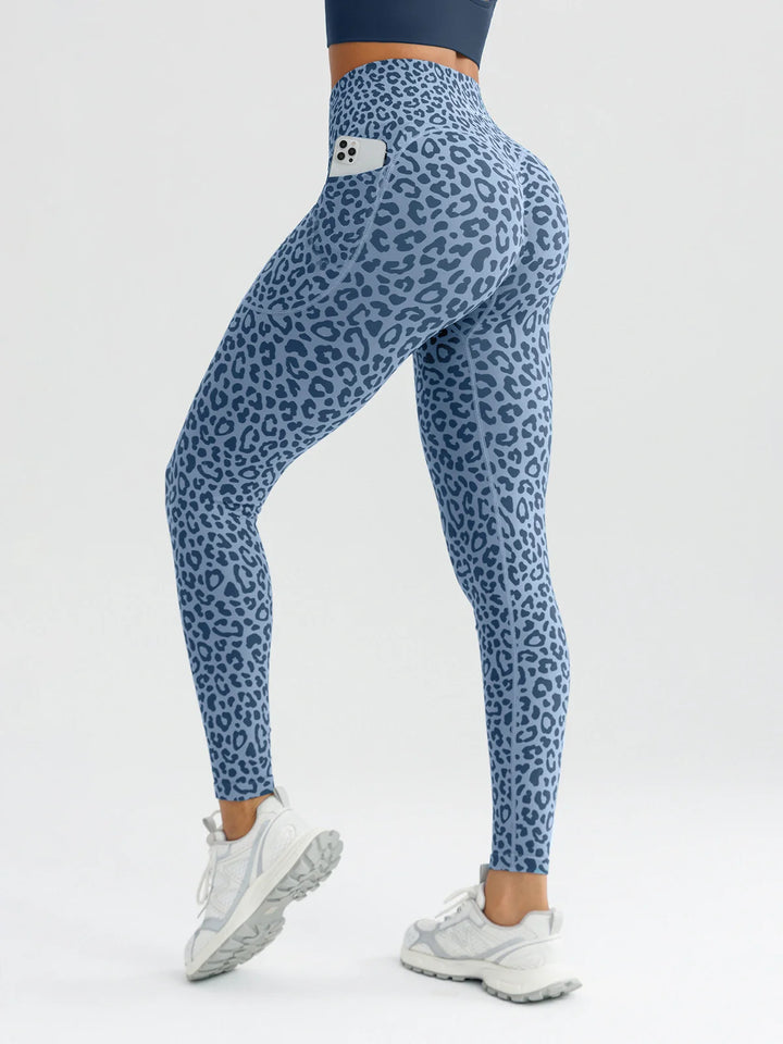 A model wearing a BRXL® B R X L™ Seamless High Waisted Butt-Lifting Leggings with Pockets