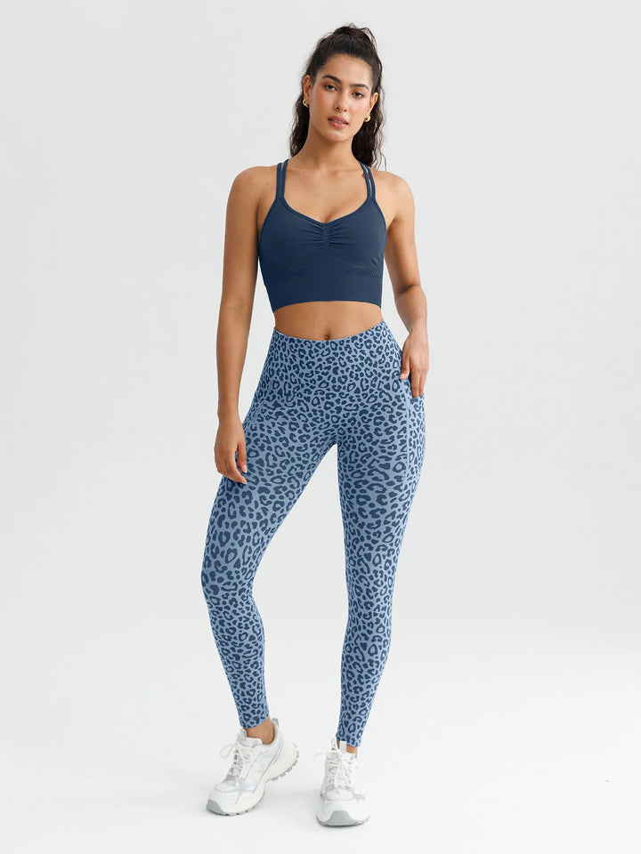 A model wearing a BRXL® B R X L™ Seamless High Waisted Butt-Lifting Leggings with Pockets