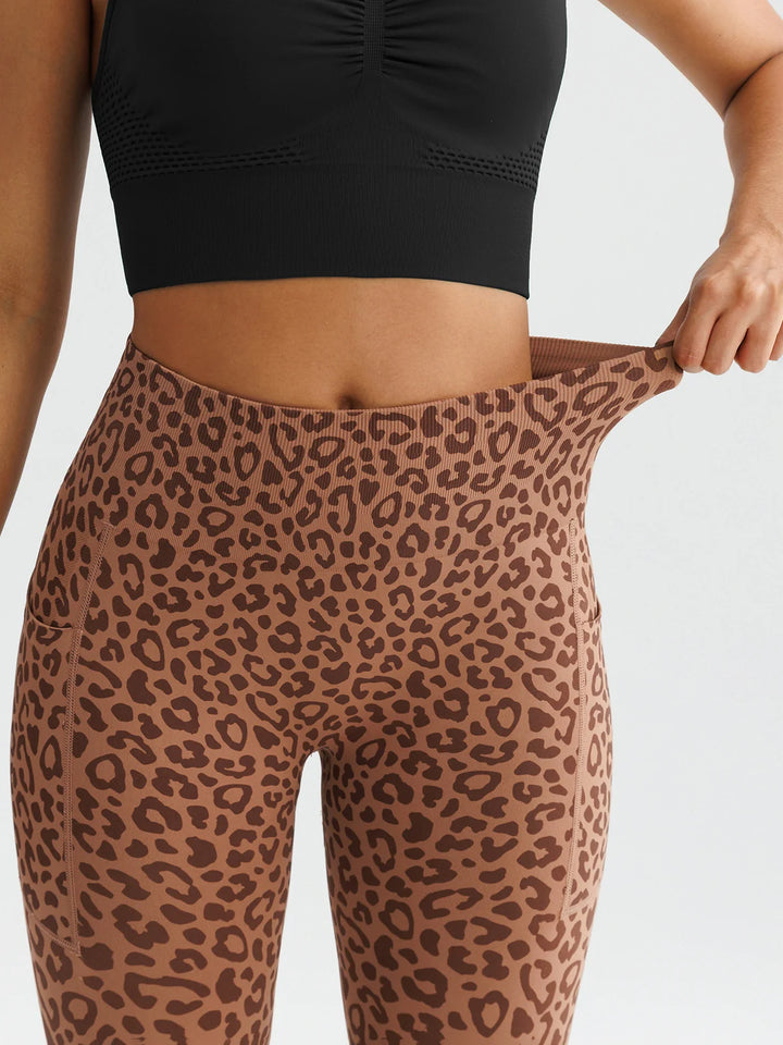 A model wearing a BRXL® B R X L™ Seamless High Waisted Butt-Lifting Leggings with Pockets