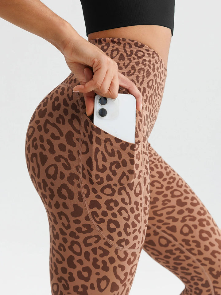 A model wearing a BRXL® B R X L™ Seamless High Waisted Butt-Lifting Leggings with Pockets